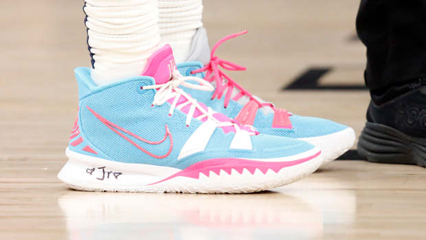View of blue and pink Nike Kyrie shoes.